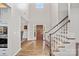 Grand foyer with hardwood floors, a staircase, and a high ceiling creating an open, airy entrance at 1849 Still Water Ln, Indian Land, SC 29707