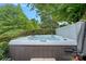 Relaxing hot tub surrounded by lush greenery, perfect for unwinding after a long day at 1849 Still Water Ln, Indian Land, SC 29707