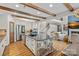 Bright kitchen featuring stainless steel appliances, a stone island, and hardwood floors at 1849 Still Water Ln, Indian Land, SC 29707