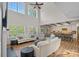 Bright and airy living room showcasing the open-concept design, hardwood floors, and access to the kitchen at 1849 Still Water Ln, Indian Land, SC 29707