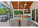 Outdoor kitchen with a built-in grill, stainless steel appliances, fire table, and comfortable seating at 1849 Still Water Ln, Indian Land, SC 29707