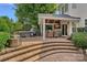 Outdoor patio with a dining table, a built-in grill, a ceiling fan and view of backyard at 1849 Still Water Ln, Indian Land, SC 29707