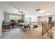 Spacious bonus room on the upper level with air hockey table, office space, and a ceiling fan at 1868 Chestnut Hill Dr, Tega Cay, SC 29708