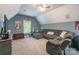 Upstairs living room with sofa, TV, carpet, and a window overlooking the backyard at 1868 Chestnut Hill Dr, Tega Cay, SC 29708