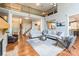 Bright living room with hardwood floors, high ceilings, and open layout to the entry and kitchen at 1868 Chestnut Hill Dr, Tega Cay, SC 29708