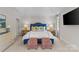 Large bedroom with tray ceiling, stylish furnishings, and recessed lighting at 206 Hillside Ave, Charlotte, NC 28209