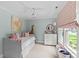 Bedroom with a daybed, dresser, ceiling fan, and colorful decor at 206 Hillside Ave, Charlotte, NC 28209