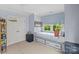 Bedroom features twin beds with window seats and built-in storage at 206 Hillside Ave, Charlotte, NC 28209