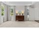 Bright bedroom featuring neutral carpet, natural light, and simple decor at 206 Hillside Ave, Charlotte, NC 28209