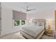 Comfortable bedroom featuring a queen size bed, window, and side tables at 206 Hillside Ave, Charlotte, NC 28209