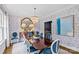 Elegant dining room featuring stylish wallpaper, chandelier, and well-appointed furnishings at 206 Hillside Ave, Charlotte, NC 28209