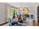 Refined dining room with chandelier, large mirror, and natural light from a window at 206 Hillside Ave, Charlotte, NC 28209