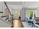 Inviting foyer showcasing hardwood floors, staircase, and elegant decor at 206 Hillside Ave, Charlotte, NC 28209