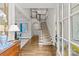 Welcoming foyer with staircase, hardwood floors, and stylish decor at 206 Hillside Ave, Charlotte, NC 28209