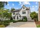 Beautiful two-story home with a circular driveway, manicured landscaping, and a gated entrance at 206 Hillside Ave, Charlotte, NC 28209