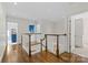 Open hallway features hardwood flooring, white walls and multiple doorways at 206 Hillside Ave, Charlotte, NC 28209