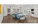 Open concept kitchen with island seating and adjacent living room, perfect for Gathering gatherings at 206 Hillside Ave, Charlotte, NC 28209