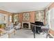 Cozy living room with fireplace, piano, and comfortable seating at 206 Hillside Ave, Charlotte, NC 28209