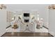 This bright living room has a white fireplace, matching furniture and hardwood floors at 206 Hillside Ave, Charlotte, NC 28209
