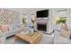 Cozy living room with fireplace, large TV, stylish decor, and natural light at 206 Hillside Ave, Charlotte, NC 28209