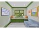 A sitting room with built-in window bench, and custom wallpaper; perfect for relaxation at 206 Hillside Ave, Charlotte, NC 28209