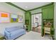 A sitting room with a blue couch and desk, perfect for relaxing or working from home at 206 Hillside Ave, Charlotte, NC 28209