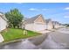 View of a row of detached garages, each with a white door and matching roof at 2065 Gable Way Ln, Matthews, NC 28104