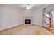 Cozy living room featuring a fireplace and staircase access at 2065 Gable Way Ln, Matthews, NC 28104