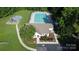Aerial view of the community pool and surrounding amenities like the playground at 2065 Gable Way Ln, Matthews, NC 28104