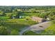 Beautiful vineyard and winery estate featuring lush greenery, a serene pond, and elegant buildings at 21047 Running Creek Dr # 9, Locust, NC 28097