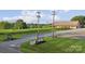 Inviting winery entrance with signage, manicured lawn and a glimpse of the vineyard and pond at 21047 Running Creek Dr # 9, Locust, NC 28097