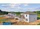 Unfinished homes under construction, showcasing the initial stages of development in a residential area at 21047 Running Creek Dr # 9, Locust, NC 28097