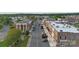 Charming downtown street with brick buildings, parked cars, and a mix of retail and commercial spaces at 21047 Running Creek Dr # 9, Locust, NC 28097