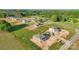 An aerial view showcases multiple new homes under construction surrounded by green landscape at 21055 Running Creek Dr # 10, Locust, NC 28097