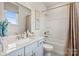 Bathroom featuring vanity with granite countertops, framed art, and tub and shower combination at 21055 Running Creek Dr # 10, Locust, NC 28097