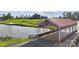 Golf course featuring a covered bridge over water, set against a backdrop of lush greenery and blue skies at 21055 Running Creek Dr # 10, Locust, NC 28097