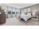 Spacious main bedroom with large windows, carpet flooring, and stylish decor at 21055 Running Creek Dr # 10, Locust, NC 28097