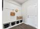 Mudroom with white wainscoting, bench seating, and storage cubbies, creating an organized transition space at 21055 Running Creek Dr # 10, Locust, NC 28097