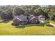 Sprawling aerial view showcasing the home, manicured grounds, and a detached garage at 214 Silver Creek Ln, Shelby, NC 28152