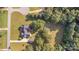 Aerial shot showcases the home with a private backyard, mature trees, detached garage, and long driveway at 214 Silver Creek Ln, Shelby, NC 28152
