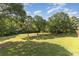 Expansive grassy backyard bordered by mature trees and partial fencing at 214 Silver Creek Ln, Shelby, NC 28152