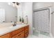 Bathroom featuring a vanity with cabinet and mirror, and a walk-in shower at 214 Silver Creek Ln, Shelby, NC 28152