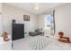 Cozy bedroom with neutral tones, ceiling fan, and a sunny window view at 214 Silver Creek Ln, Shelby, NC 28152