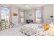 Bright bedroom featuring carpeted floors, and large windows at 214 Silver Creek Ln, Shelby, NC 28152