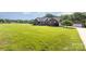 Lovely exterior of a brick home showcasing a detached garage and green lawn at 214 Silver Creek Ln, Shelby, NC 28152