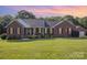 Charming one-story brick home with black shutters, manicured lawn, and an inviting front porch at 214 Silver Creek Ln, Shelby, NC 28152