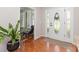 Bright foyer with hardwood floors, a decorative front door, and a view of a cozy sitting area at 214 Silver Creek Ln, Shelby, NC 28152