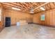Unfinished garage interior with ample space and plywood walls at 214 Silver Creek Ln, Shelby, NC 28152