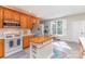 Kitchen with stainless appliances, light countertops, wood cabinets, and a window view at 214 Silver Creek Ln, Shelby, NC 28152