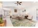 Open-concept living room with a vaulted ceiling, neutral color scheme, and comfortable seating at 214 Silver Creek Ln, Shelby, NC 28152